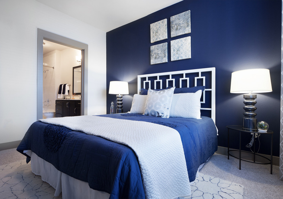 Design ideas for a mid-sized transitional master bedroom in Dallas with blue walls and carpet.