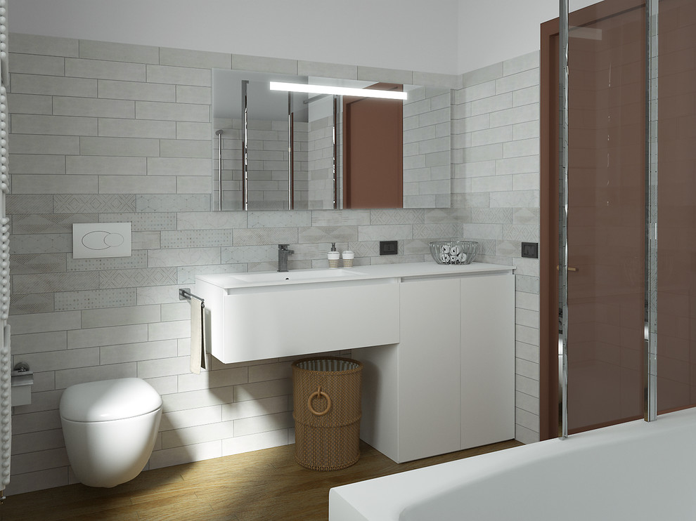 Inspiration for a small modern 3/4 bathroom in Other with flat-panel cabinets, white cabinets, a shower/bathtub combo, a wall-mount toilet, gray tile, porcelain tile, white walls, bamboo floors, an integrated sink, brown floor, an open shower, white benchtops, solid surface benchtops, a drop-in tub, a single vanity and a floating vanity.