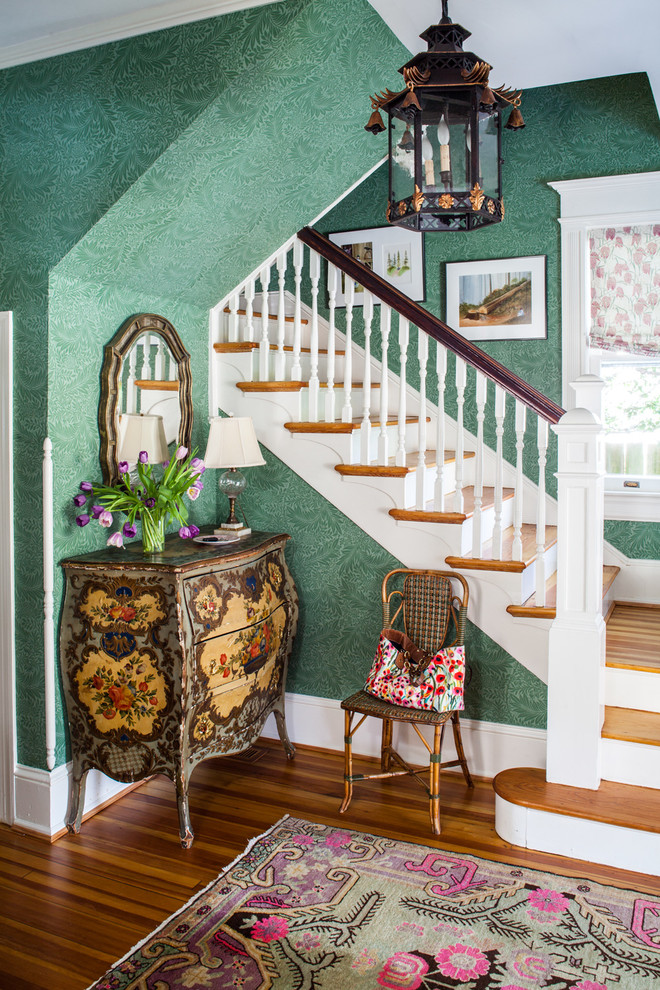 Example of a small classic dark wood floor foyer design in DC Metro with green walls