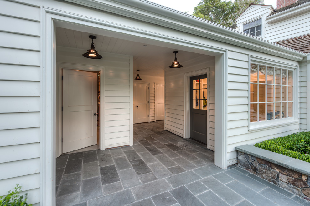 Large traditional entryway in San Francisco with a single front door and a gray front door.