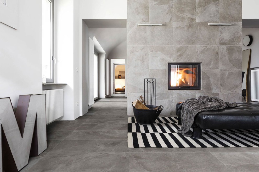 Photo of a family room in Bologna with porcelain floors and grey floor.