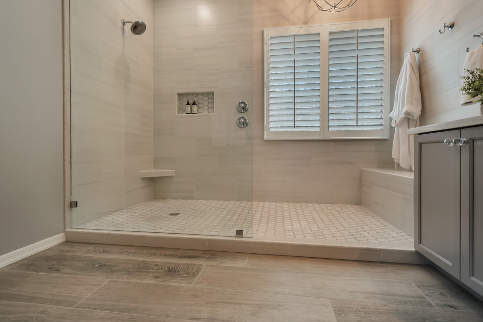 Inspiration for a mid-sized transitional master white tile and porcelain tile wood-look tile floor, multicolored floor and double-sink doorless shower remodel in Phoenix with shaker cabinets, gray cabinets, gray walls, an undermount sink, granite countertops, white countertops and a niche