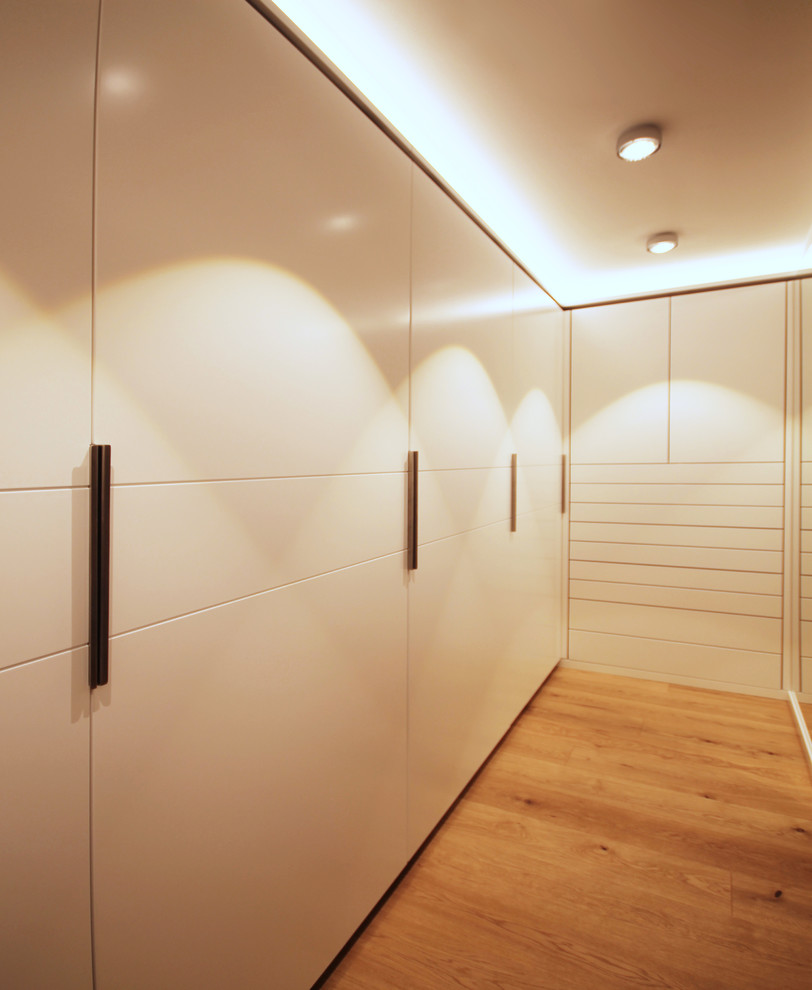 Photo of a contemporary storage and wardrobe in Munich.