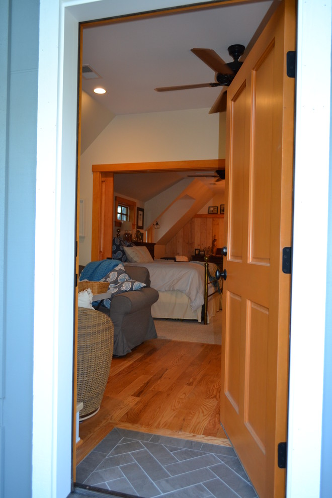 Inspiration for a small ceramic tile front door remodel in Baltimore with a light wood front door and beige walls