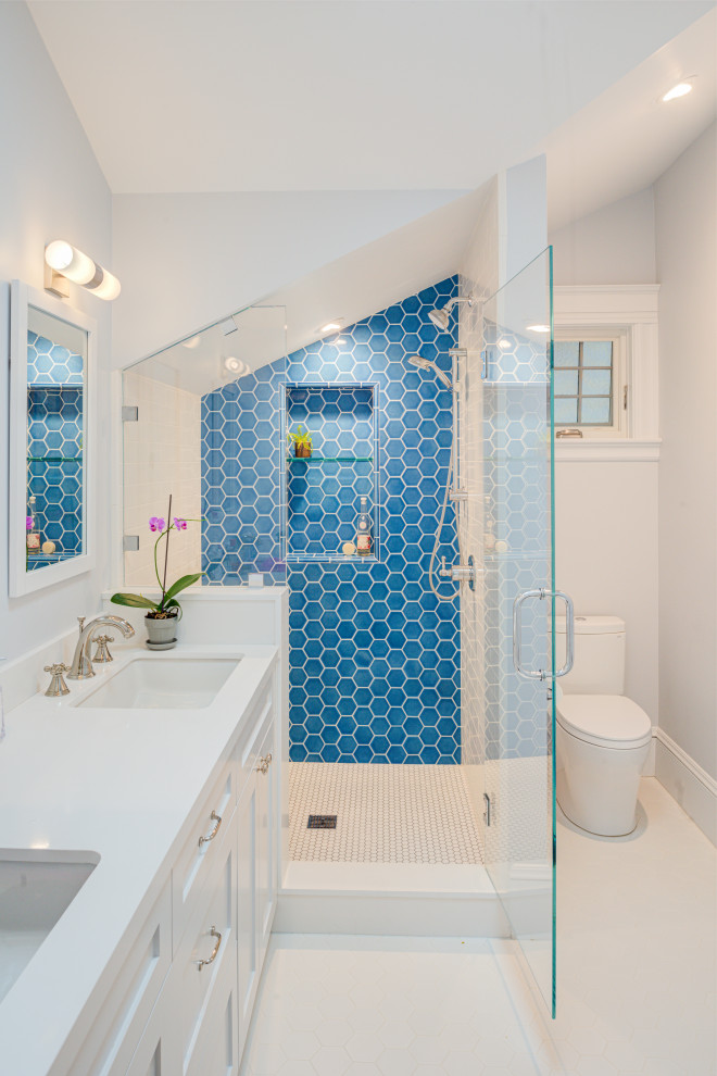 Photo of a large transitional 3/4 bathroom in San Francisco with stone tile, white walls, an undermount sink, quartzite benchtops, white floor, white benchtops, shaker cabinets, white cabinets, an alcove shower, a two-piece toilet, blue tile and a hinged shower door.