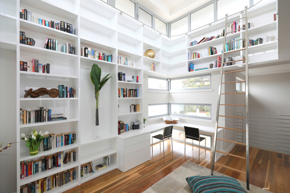 This is an example of a contemporary family room in Perth with a library.