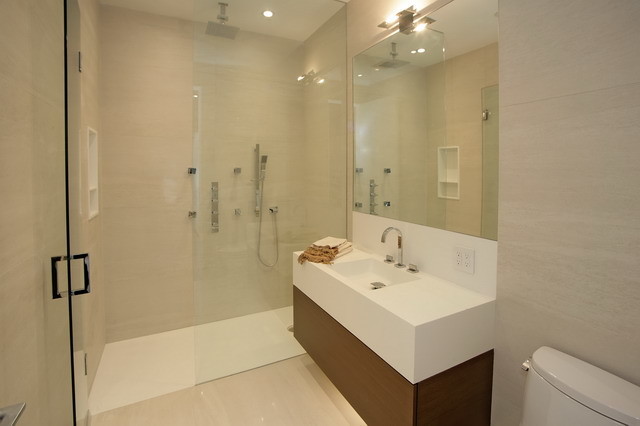 This is an example of a mid-sized modern 3/4 bathroom in Toronto with flat-panel cabinets, medium wood cabinets, an alcove shower, a two-piece toilet, beige walls, ceramic floors, a trough sink and solid surface benchtops.