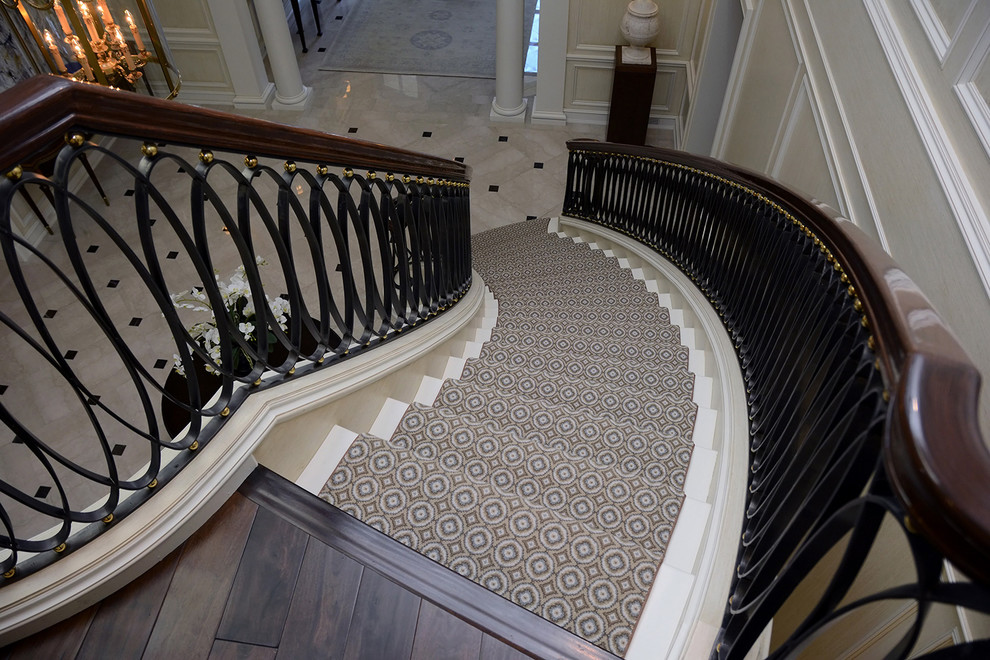Design ideas for a large contemporary carpeted curved staircase in Detroit with carpet risers.