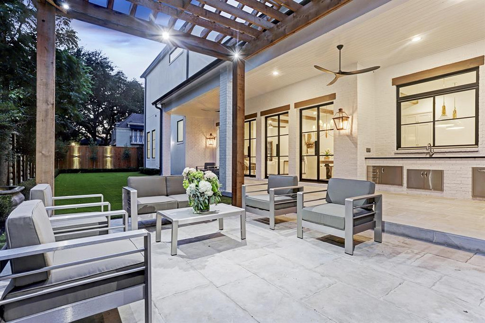 Design ideas for a contemporary backyard patio in Houston with an outdoor kitchen, concrete slab and a pergola.