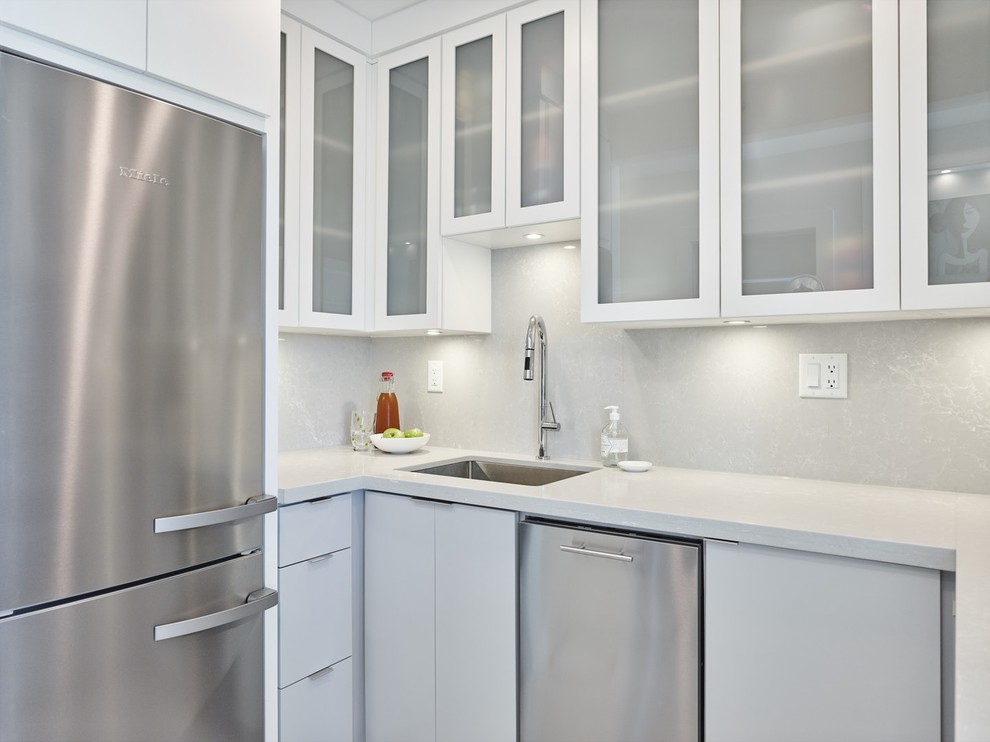 Kitchen pantry - small modern l-shaped kitchen pantry idea in Vancouver with glass-front cabinets and white cabinets