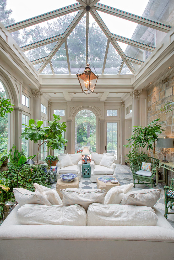 Design ideas for a large traditional sunroom in Omaha with marble floors.