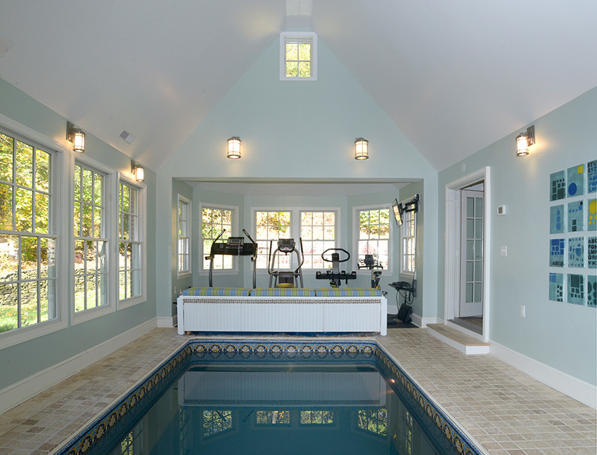 Mid-sized transitional indoor rectangular lap pool in Boston with a pool house and tile.