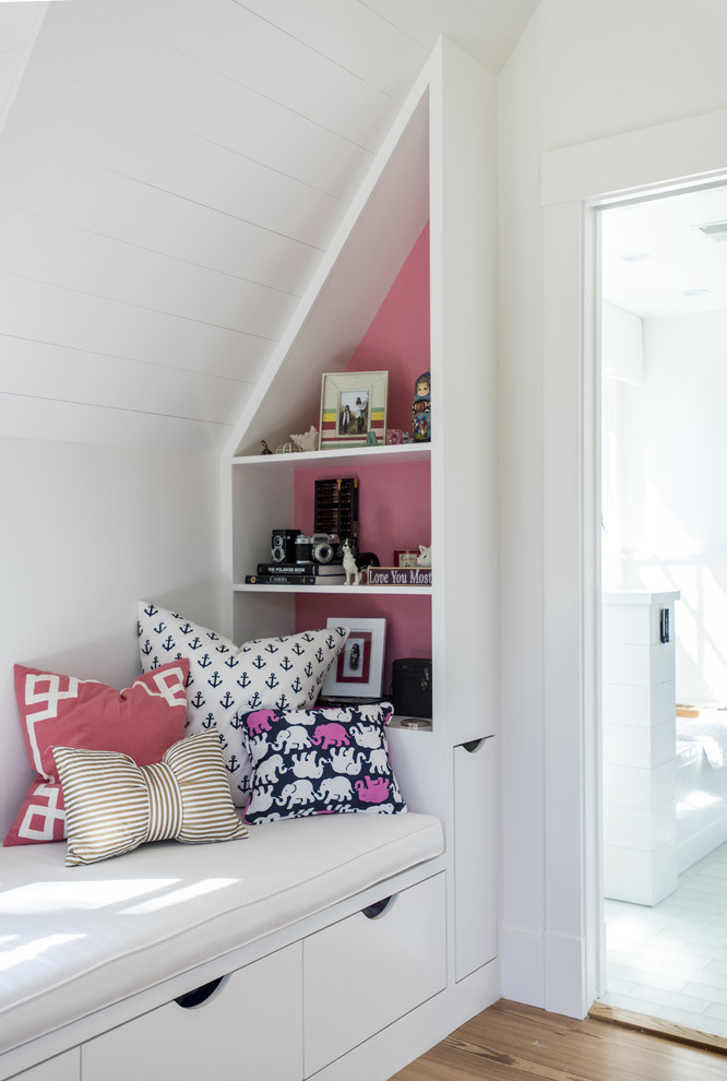This is an example of a mid-sized modern kids' room for girls in Louisville with white walls and medium hardwood floors.