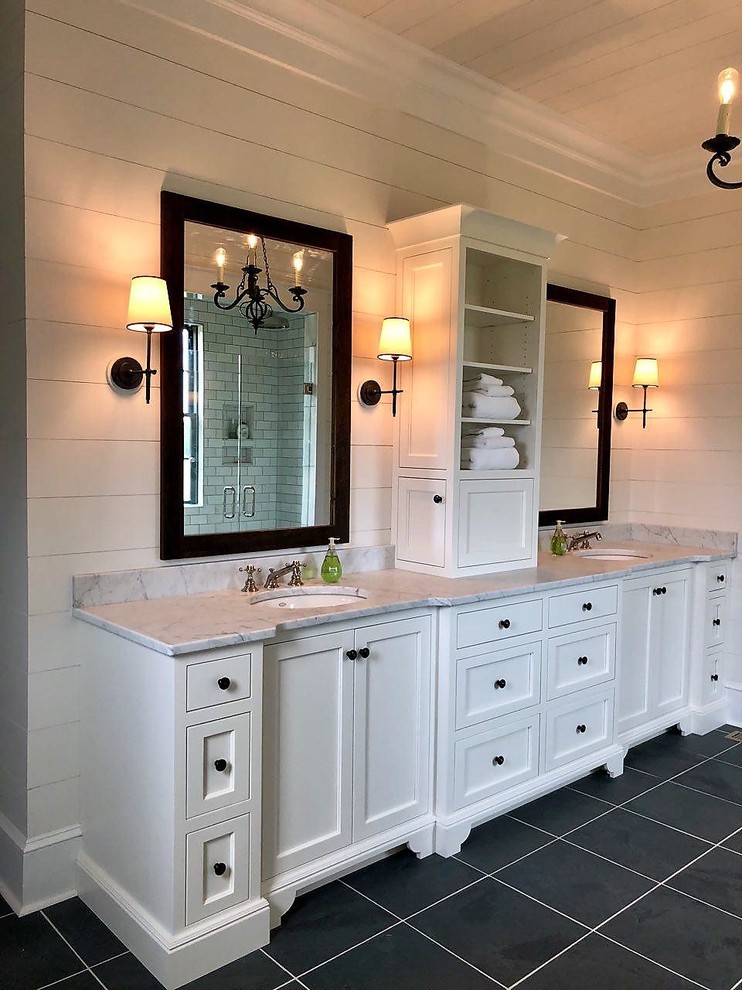 This is an example of a mid-sized traditional master bathroom in Other with flat-panel cabinets, white cabinets, white walls, porcelain floors, a wall-mount sink, granite benchtops, black floor and multi-coloured benchtops.