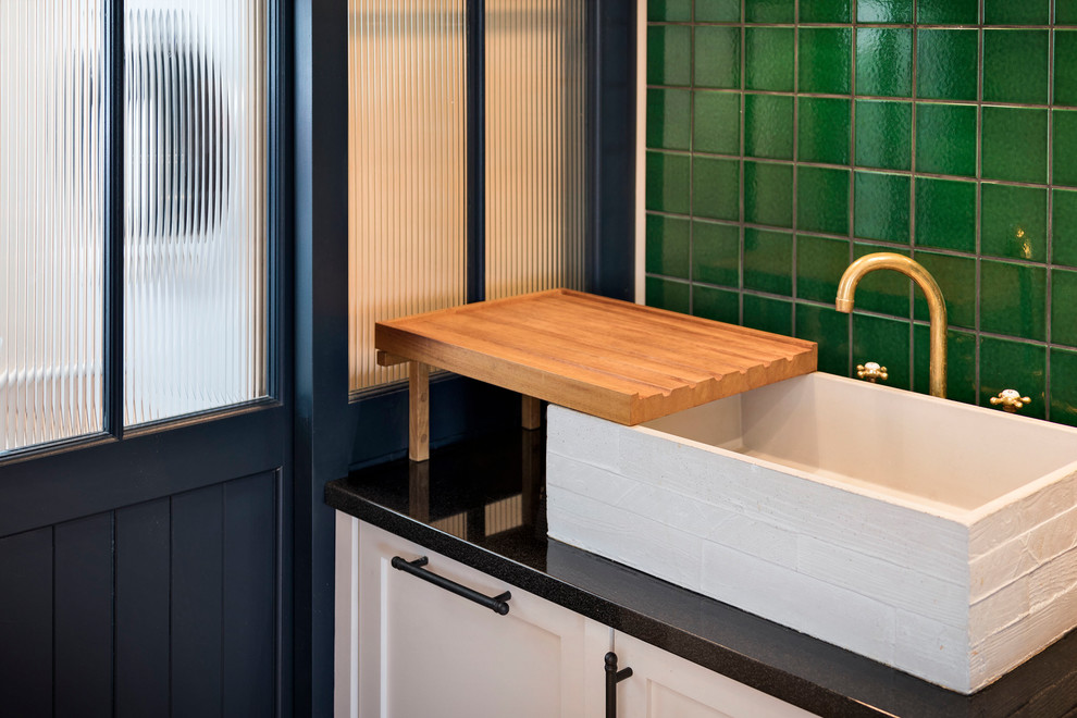 This is an example of a small transitional bathroom in London.