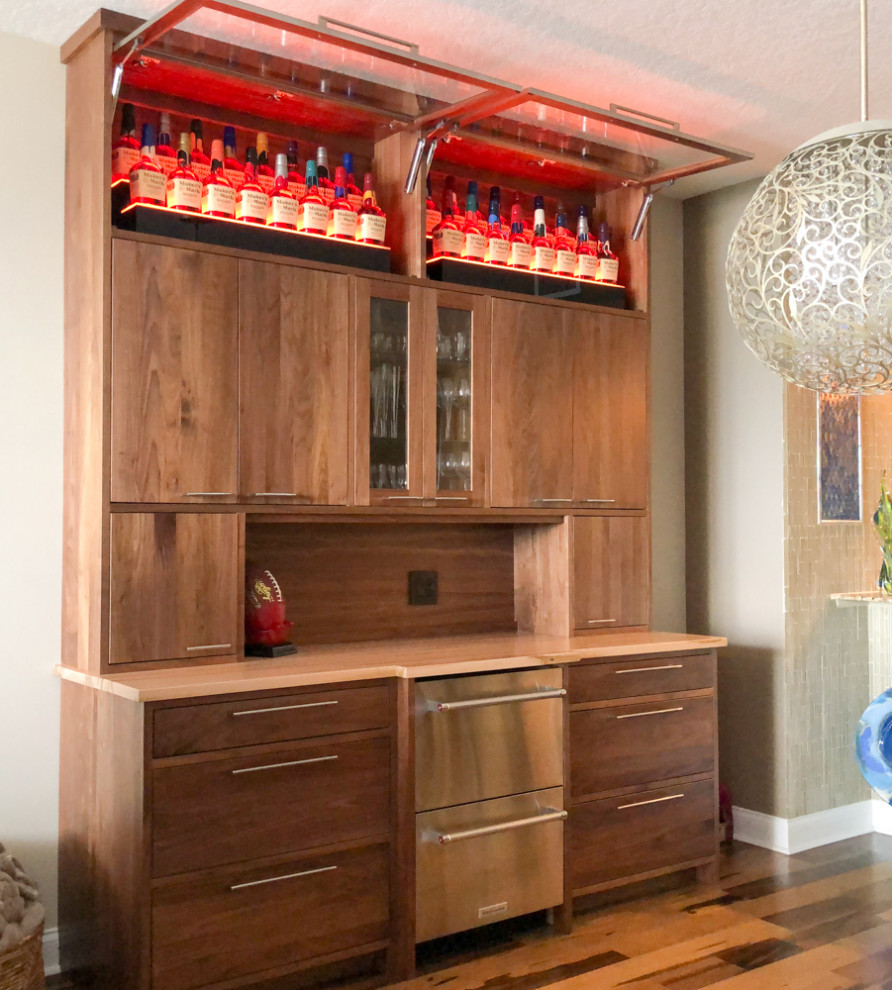 Inspiration for a mid-sized modern home bar with no sink, flat-panel cabinets, medium wood cabinets, wood benchtops, timber splashback and multi-coloured benchtop.