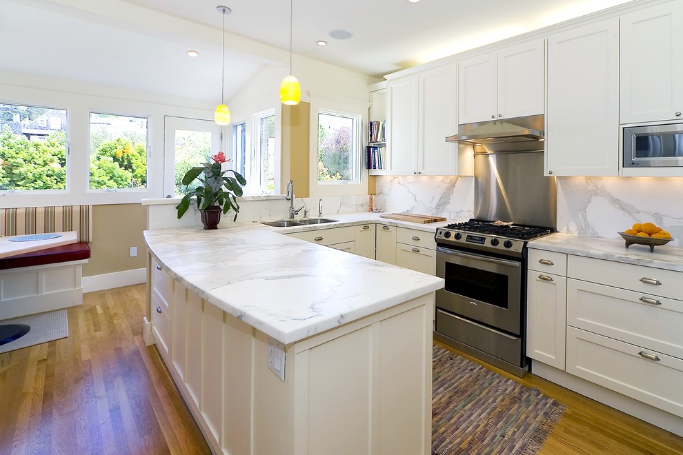 Photo of a traditional kitchen in San Francisco with marble benchtops and marble splashback.