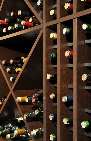 Design ideas for a mid-sized mediterranean wine cellar in New York with cork floors and diamond bins.