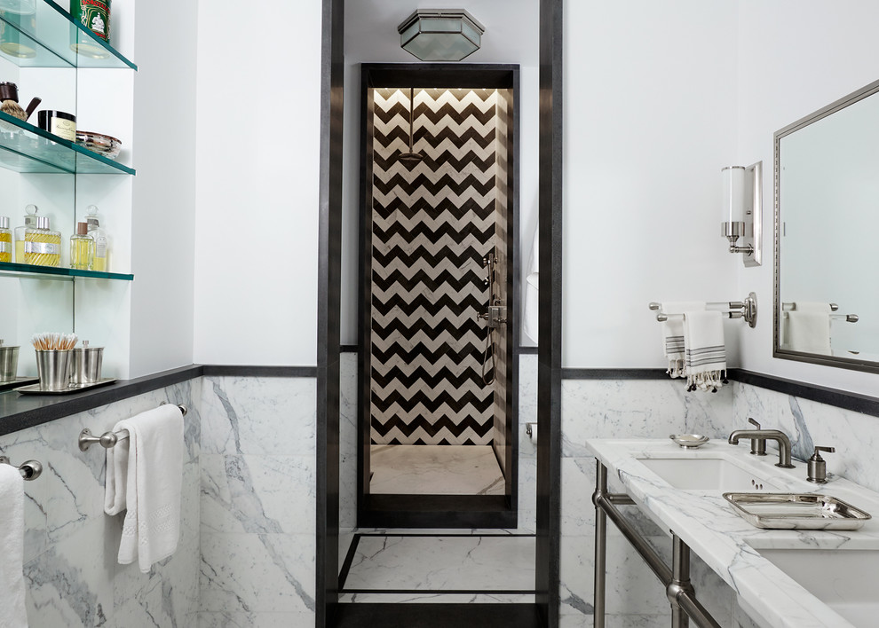Photo of a large contemporary master bathroom in New York with an alcove shower, a one-piece toilet, black and white tile, yellow walls, marble floors, an undermount sink and marble benchtops.