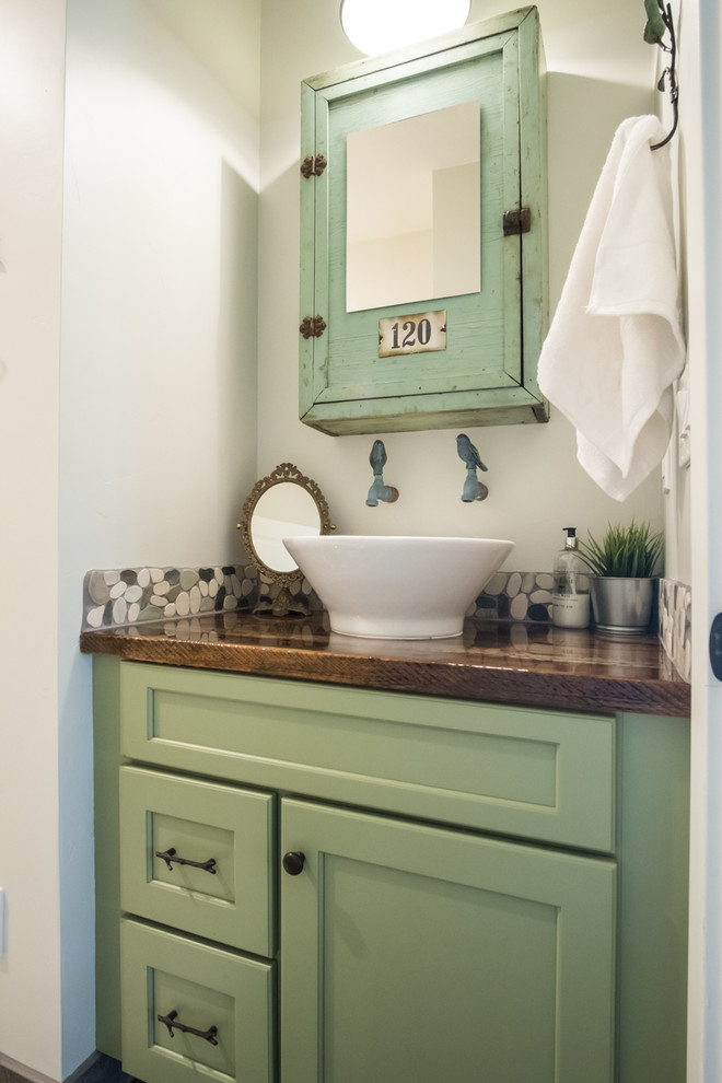 Small traditional 3/4 bathroom in Portland with shaker cabinets, green cabinets, multi-coloured tile, stone tile, white walls, a vessel sink, wood benchtops and brown benchtops.