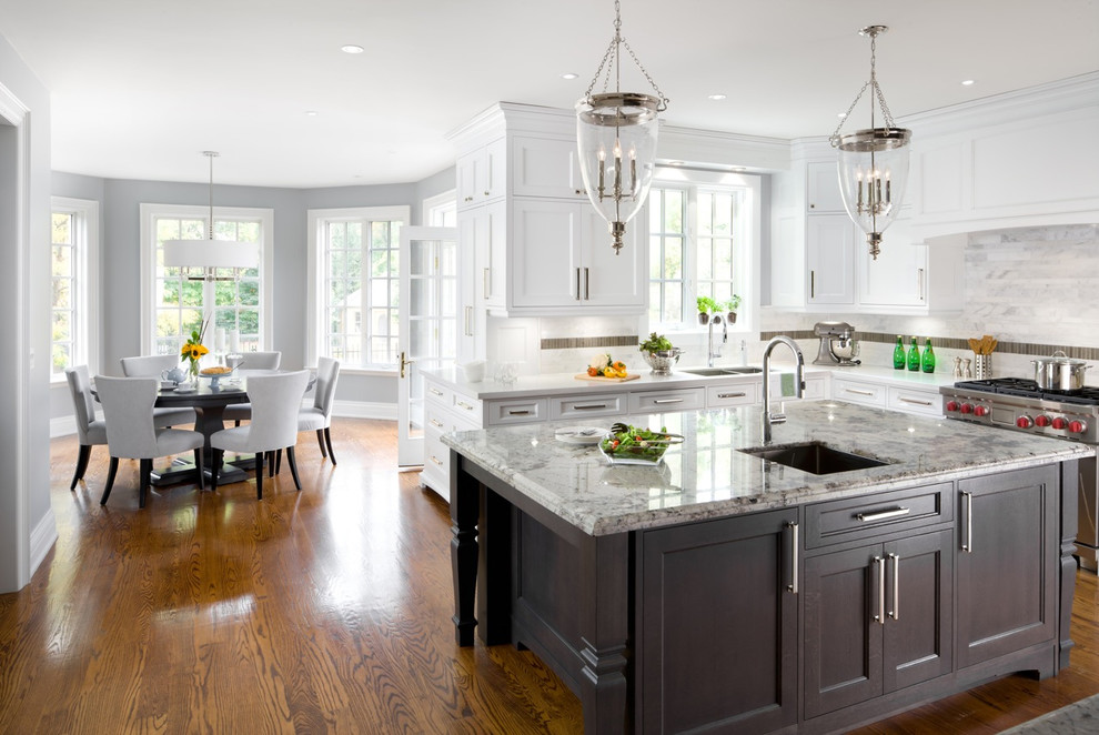 Inspiration for a traditional eat-in kitchen in Detroit with an undermount sink, shaker cabinets, white cabinets, granite benchtops, white splashback, stainless steel appliances and marble splashback.