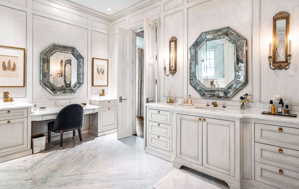 Inspiration for an expansive world-inspired grey and white ensuite wet room bathroom in Miami with grey cabinets, beige walls, ceramic flooring, an integrated sink, marble worktops, blue floors, white worktops, a single sink, a built in vanity unit, a hinged door, a submerged bath, a one-piece toilet and recessed-panel cabinets.
