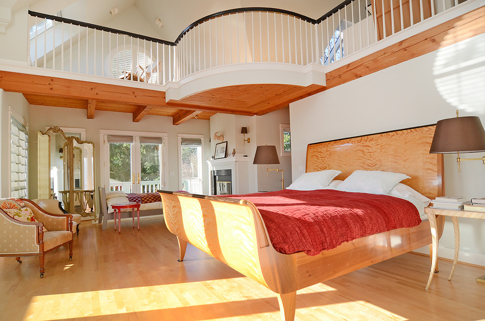 Photo of a traditional bedroom in Seattle with beige walls and medium hardwood floors.