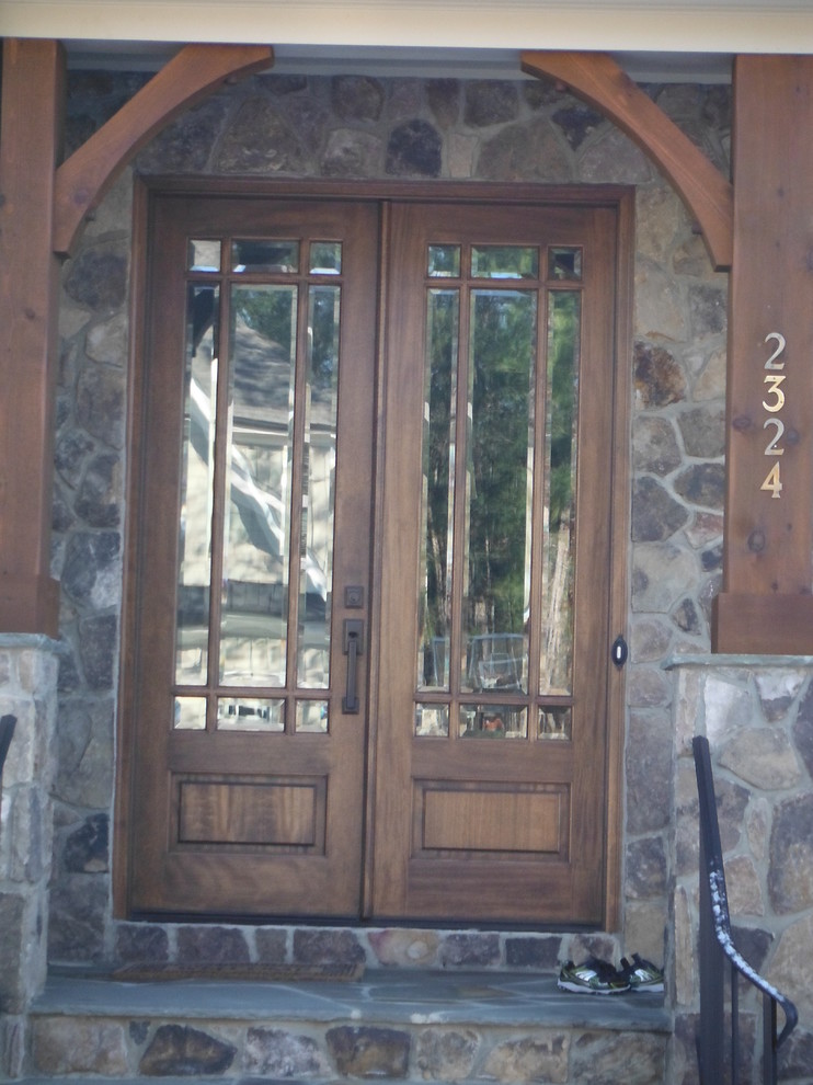 Design ideas for a traditional entryway in Raleigh with a double front door and a medium wood front door.