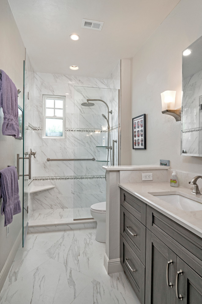 Small transitional master bathroom in Miami with flat-panel cabinets, grey cabinets, an alcove shower, a two-piece toilet, white tile, porcelain tile, white walls, porcelain floors, an undermount sink, engineered quartz benchtops, multi-coloured floor, a hinged shower door, white benchtops, a shower seat, a single vanity and a built-in vanity.
