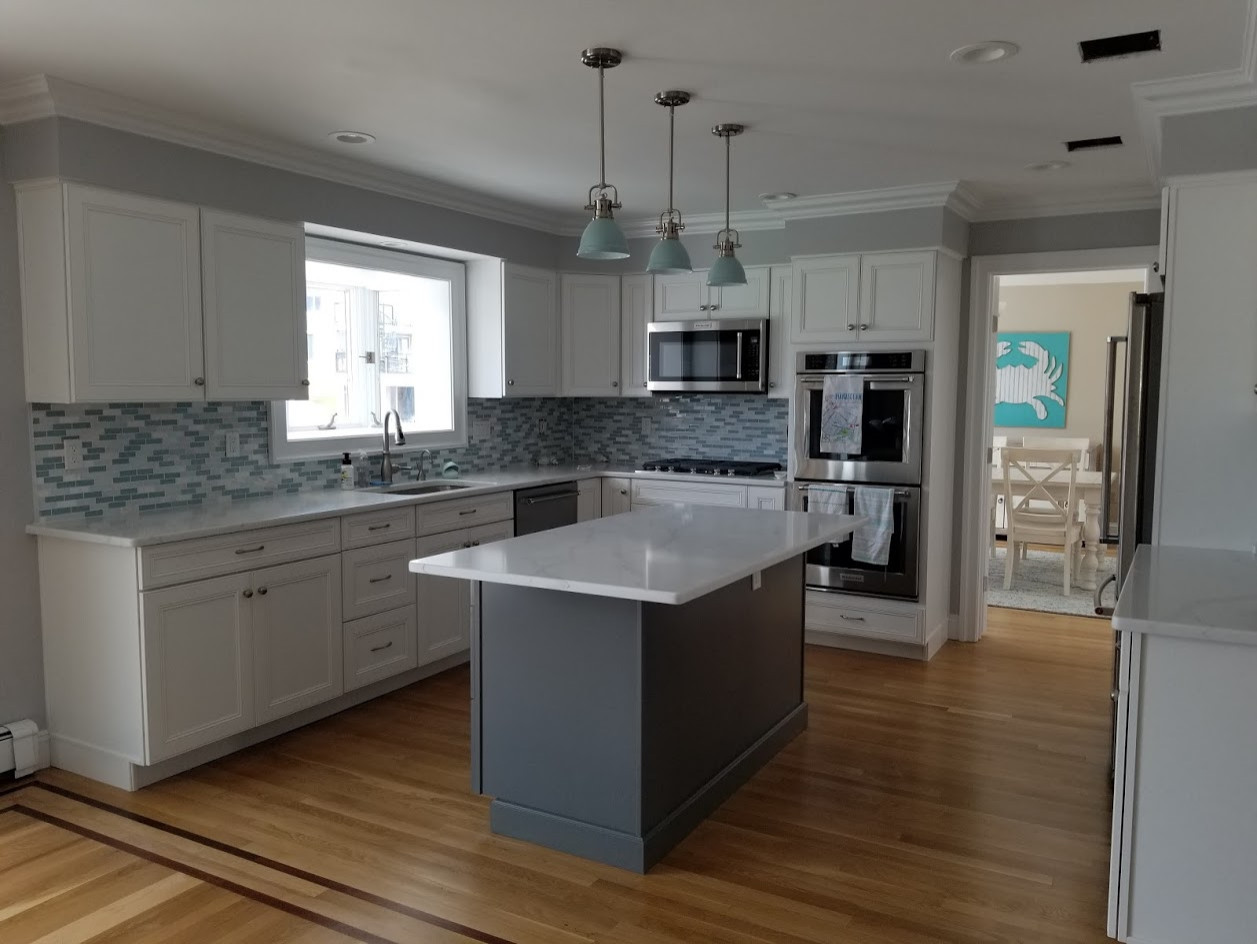 Renovation of shore home with stylish shaker cabinets and quartz tops to give a give the home a new look!
