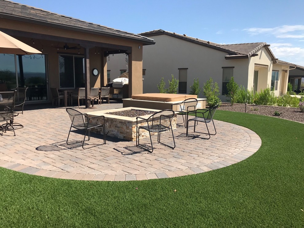 Example of a large eclectic home design design in Phoenix