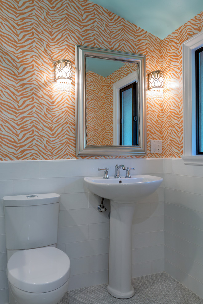 Inspiration for a mid-sized country 3/4 bathroom in San Francisco with a one-piece toilet, white tile, subway tile, orange walls, a pedestal sink and beige floor.