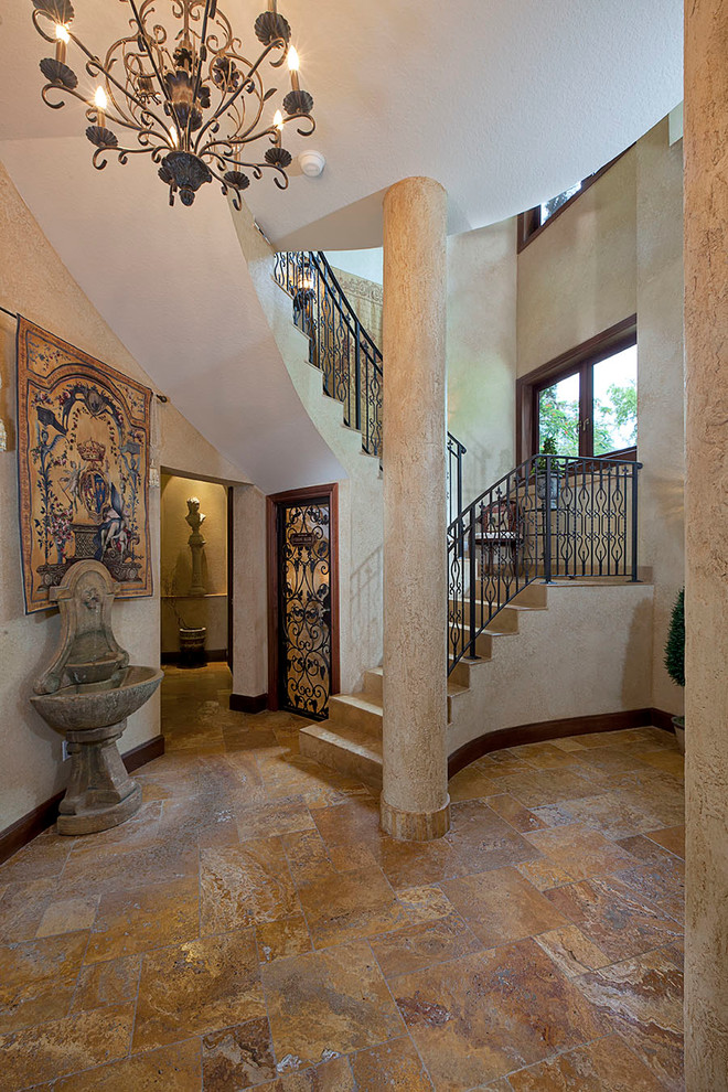 Foyer - mid-sized rustic slate floor and beige floor foyer idea in Miami with a dark wood front door and beige walls