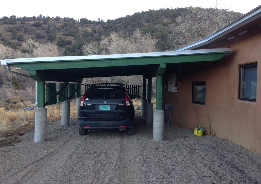 Photo of a small eclectic attached one-car carport in Albuquerque.