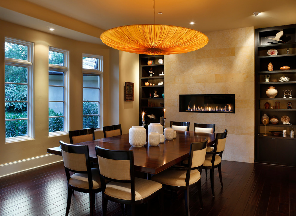This is an example of a contemporary dining room in San Francisco with beige walls and dark hardwood floors.