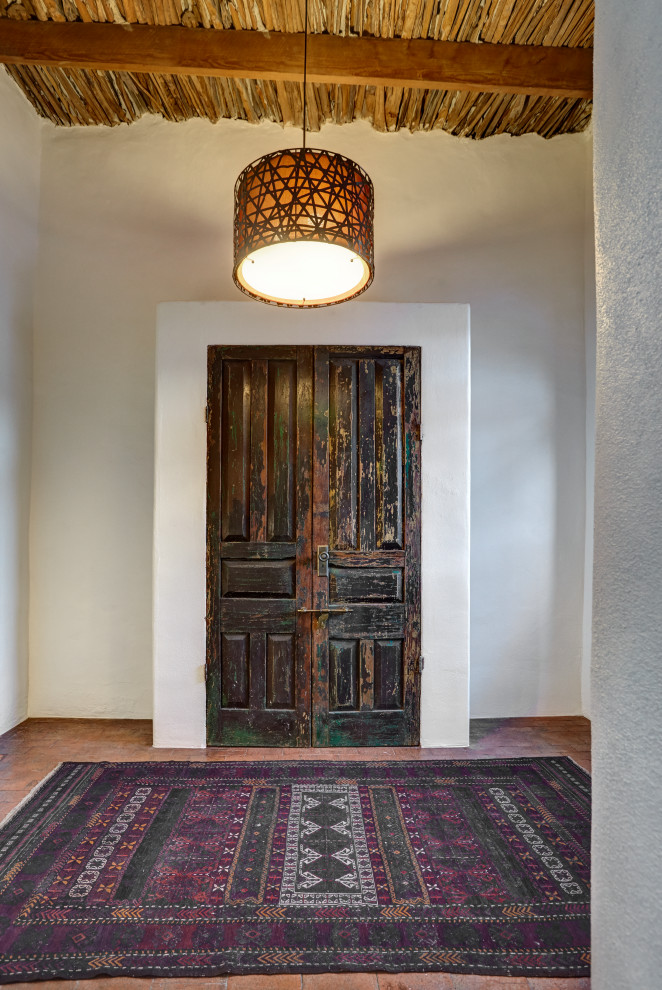 Inspiration for a rustic entryway remodel in Phoenix