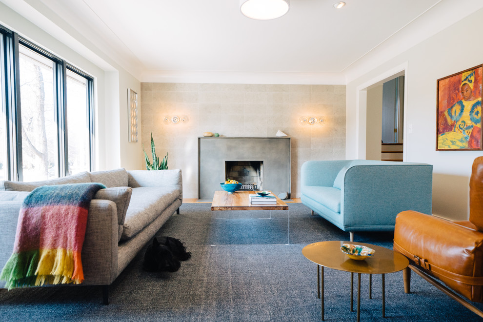 Inspiration for a midcentury formal enclosed living room in Louisville with grey walls, a standard fireplace, a concrete fireplace surround and no tv.