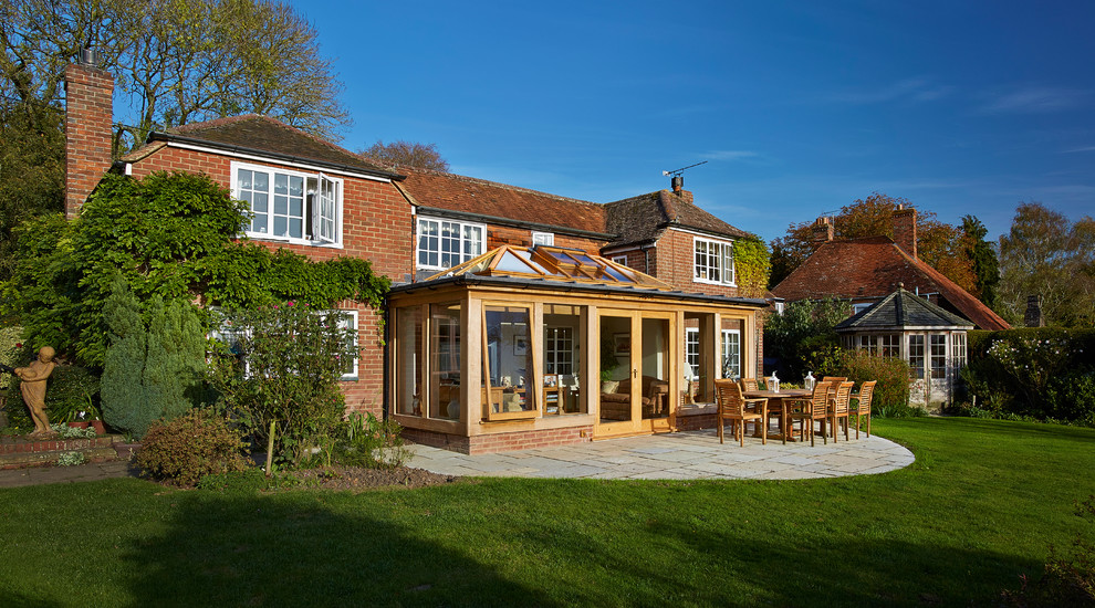 This is an example of a mid-sized traditional sunroom in Berkshire with a skylight.