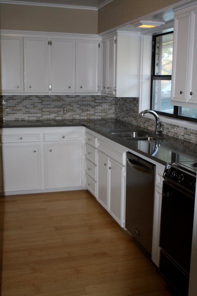 Home design - transitional home design idea with medium tone wood cabinets, granite countertops and an island