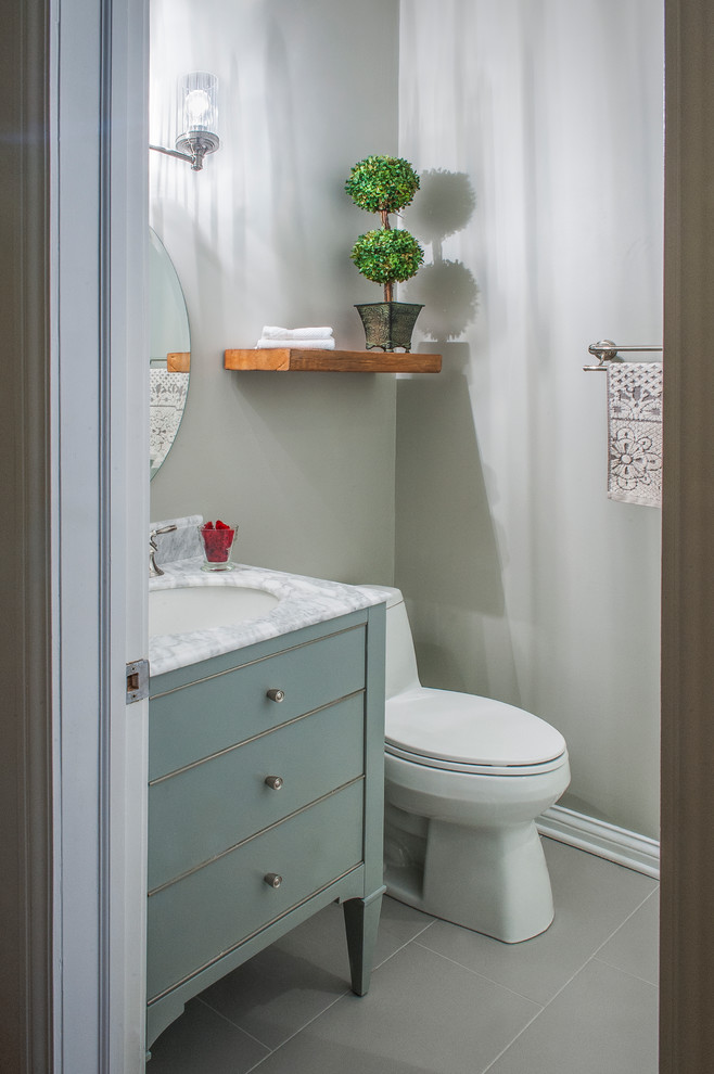 Small modern 3/4 bathroom in Chicago with furniture-like cabinets, green cabinets, an open shower, a one-piece toilet, white tile, marble, grey walls, porcelain floors, an undermount sink and marble benchtops.