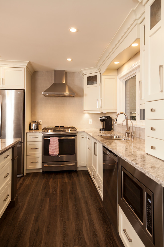 Example of a transitional kitchen design in Toronto