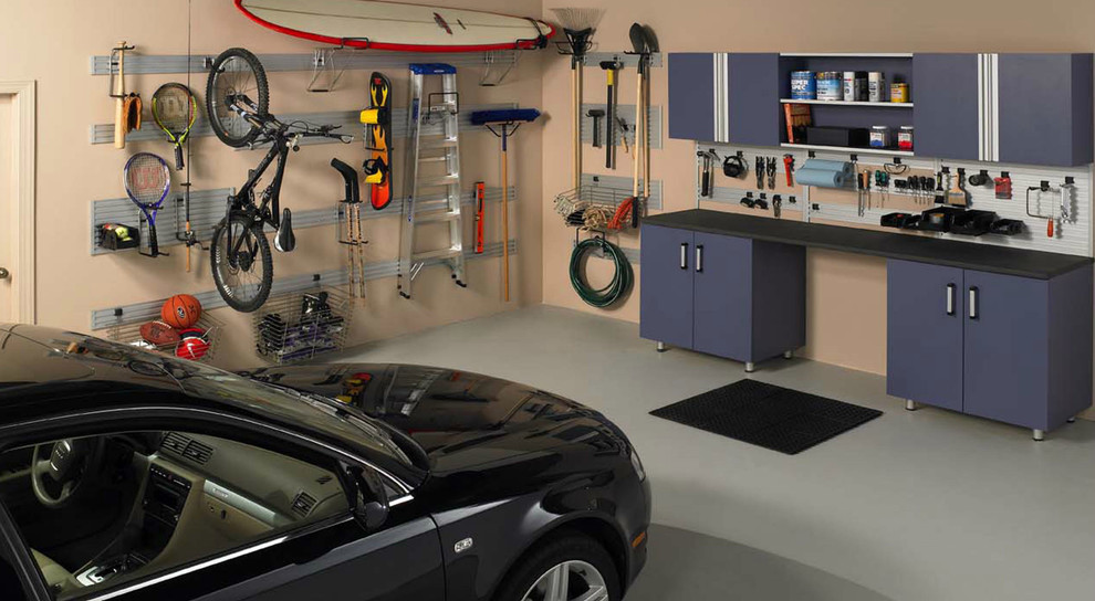 Mid-sized minimalist attached two-car garage photo in Orange County