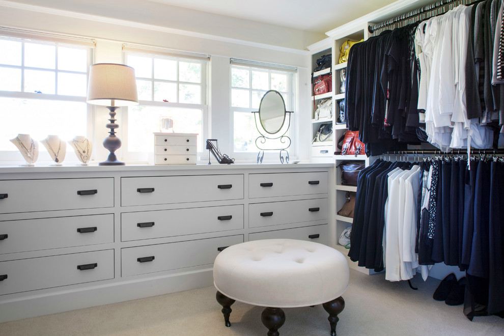This is an example of a large traditional women's dressing room in Portland with flat-panel cabinets, white cabinets and ceramic floors.