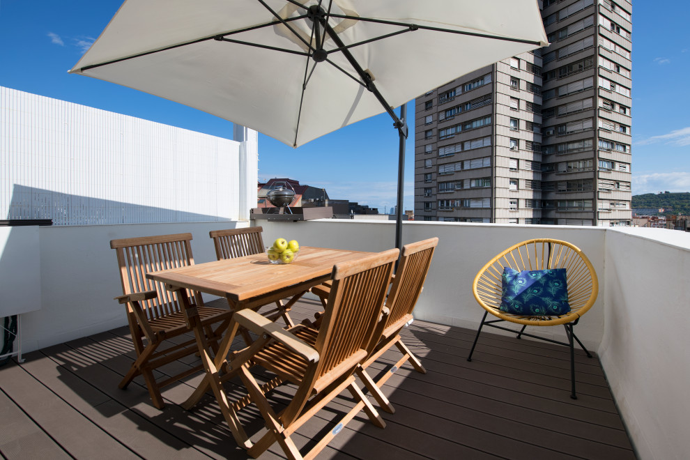 This is an example of a mid-sized scandinavian rooftop deck in Other with with privacy feature.