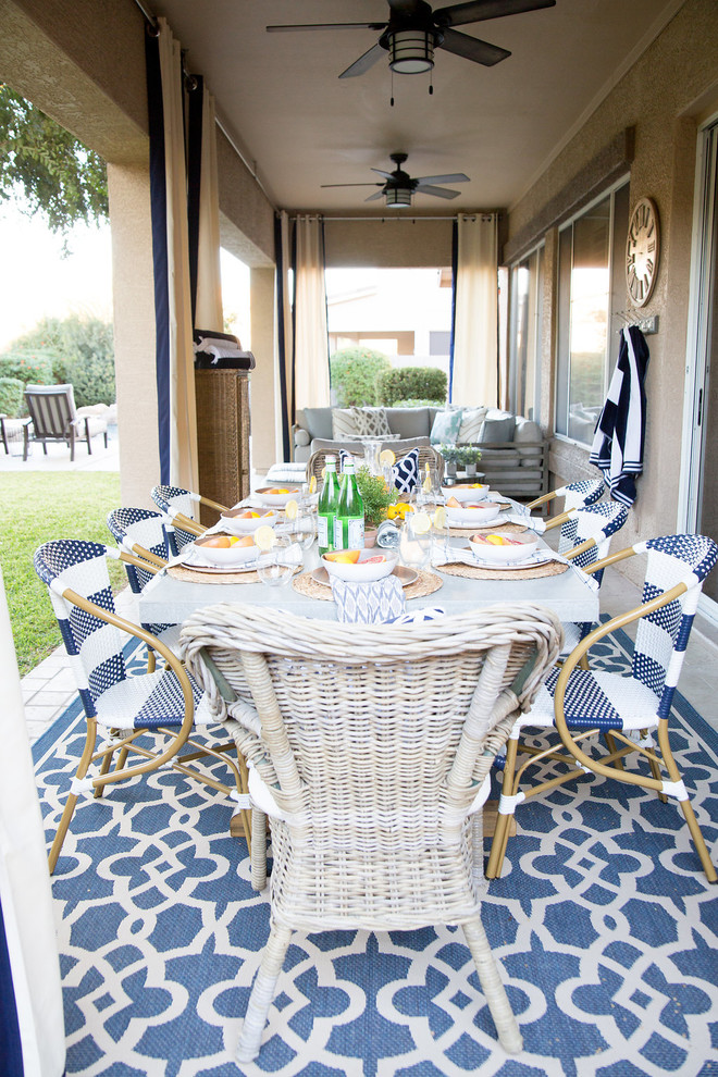 Patio - mid-sized transitional backyard brick patio idea in Phoenix with a roof extension