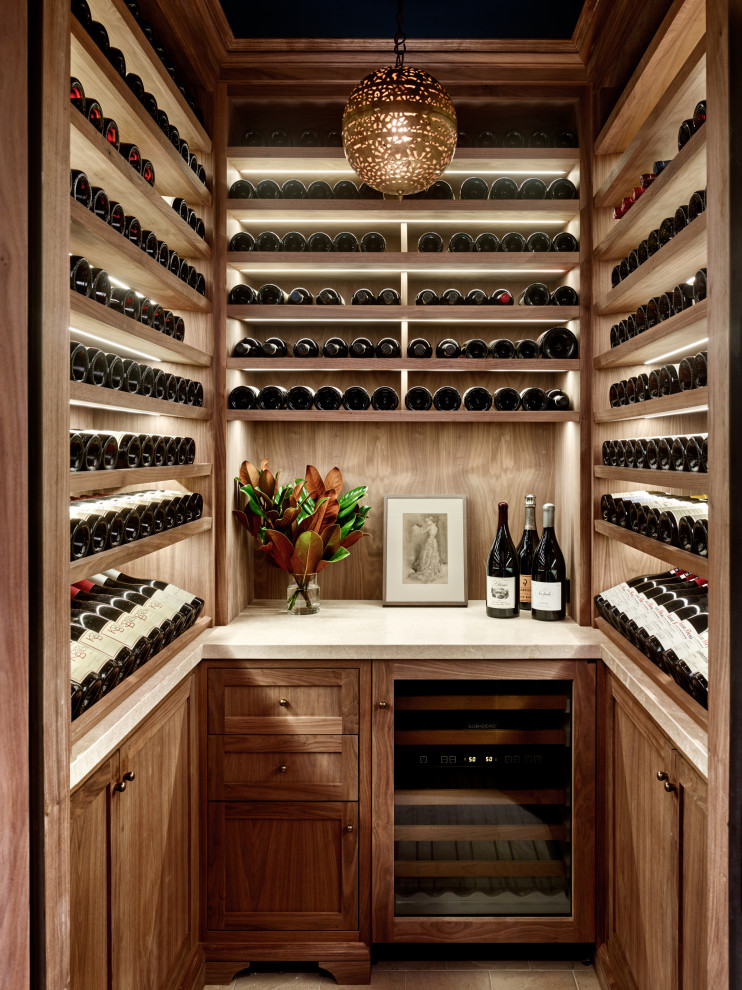 Design ideas for a transitional wine cellar in San Francisco with display racks and beige floor.