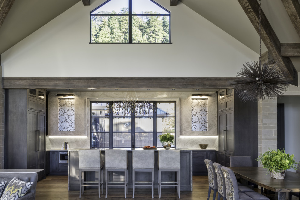 Kitchen - rustic kitchen idea in Denver with recessed-panel cabinets, gray cabinets and an island
