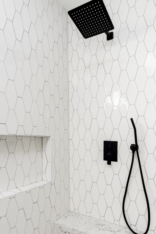 Photo of a medium sized modern shower room bathroom in Los Angeles with louvered cabinets, white cabinets, a built-in bath, an alcove shower, a one-piece toilet, black and white tiles, porcelain tiles, white walls, light hardwood flooring, a console sink, grey floors, a sliding door, white worktops, a shower bench, double sinks, a freestanding vanity unit and a coffered ceiling.