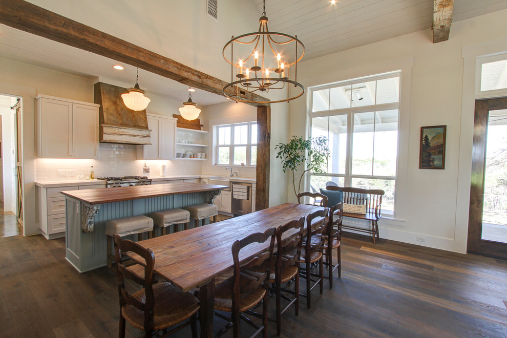 This is an example of a large country kitchen/dining combo in Austin.