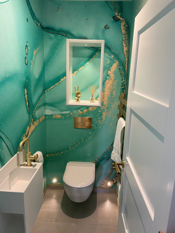 Small trendy wallpaper powder room photo in Other with green walls